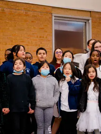 Border CrosSing education participants sing together