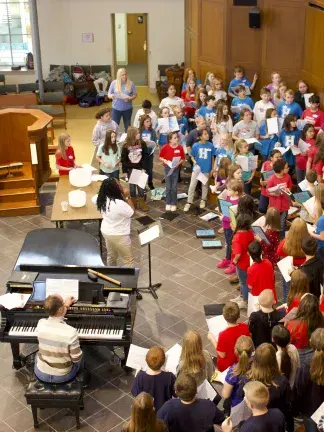 Voices in the Laurel students sing together